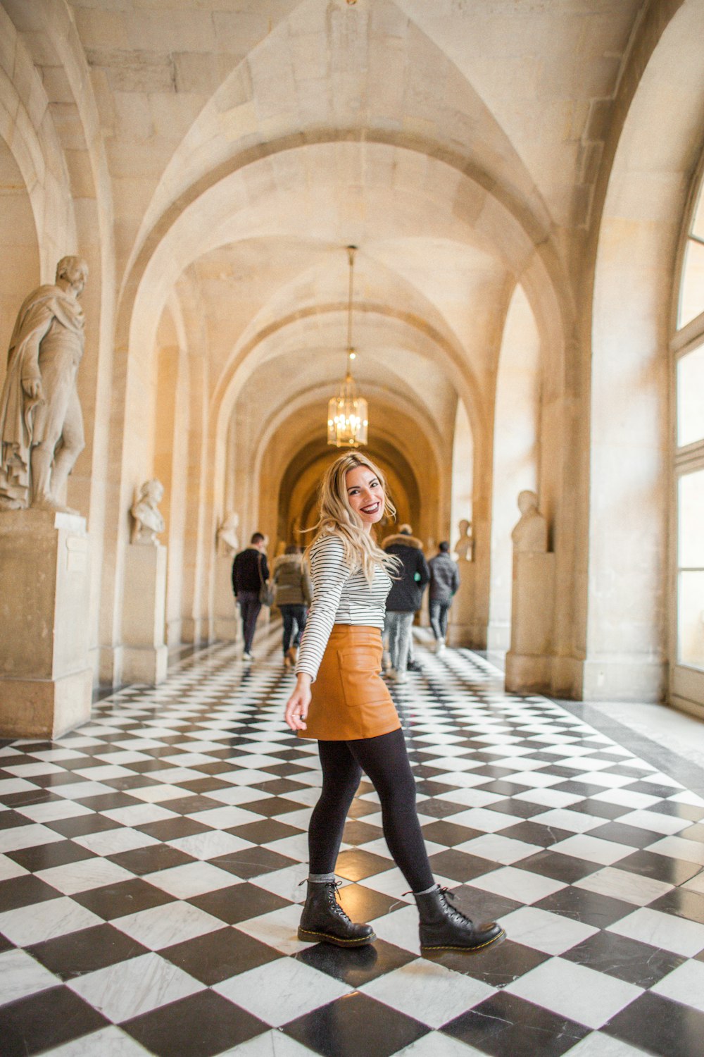 smiling woman standing on hallwayu