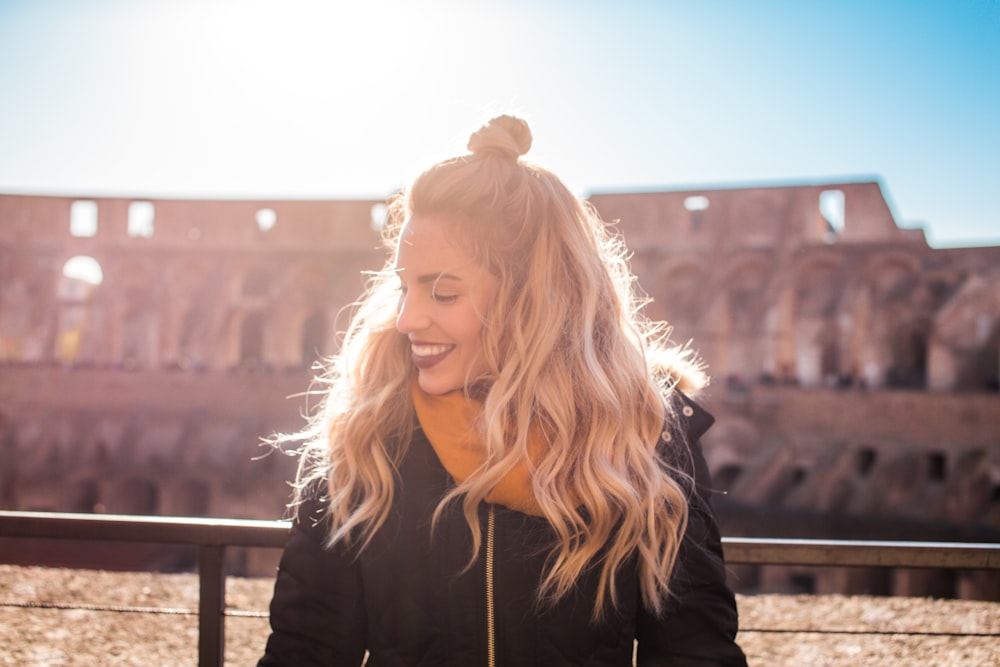 woman standing in front of handrail