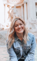 woman smiling wearing denim jacket