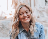 woman smiling wearing denim jacket