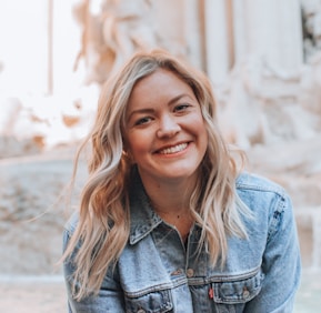 woman smiling wearing denim jacket