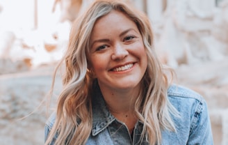 woman smiling wearing denim jacket