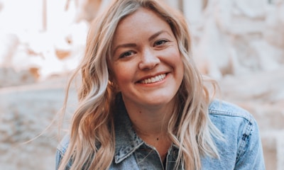 woman smiling wearing denim jacket