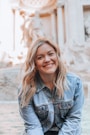 woman smiling wearing denim jacket