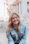 woman smiling wearing denim jacket