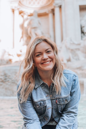 woman smiling wearing denim jacket
