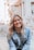 woman smiling wearing denim jacket