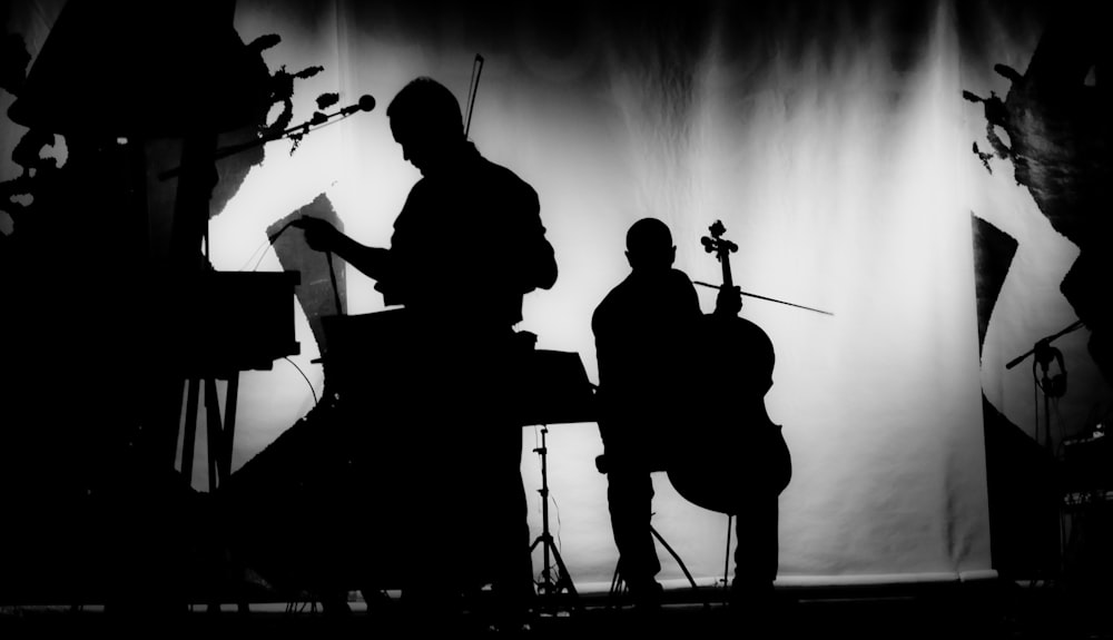 silhouette of musicians playing