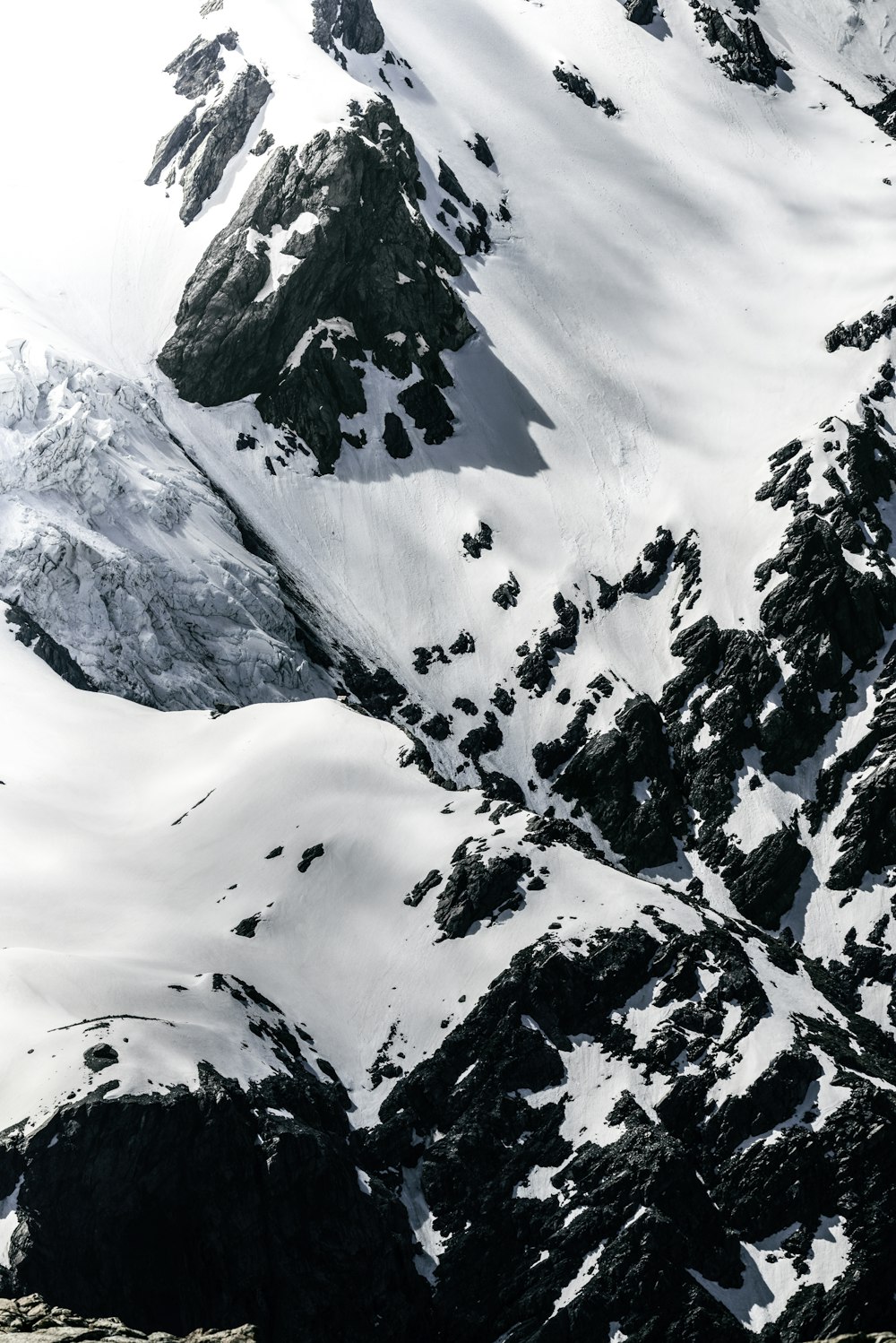 aerial photo of snow covered mountain at daytime