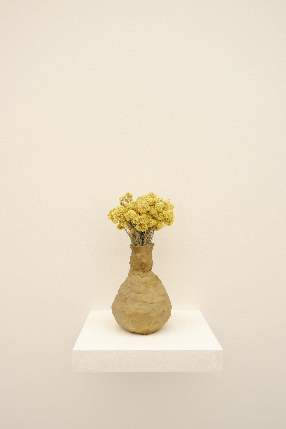 vase of yellow flowers