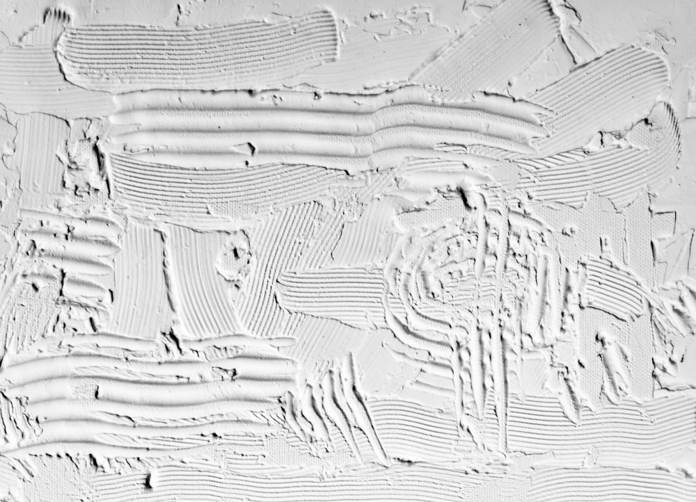 a close up of a white textured wall