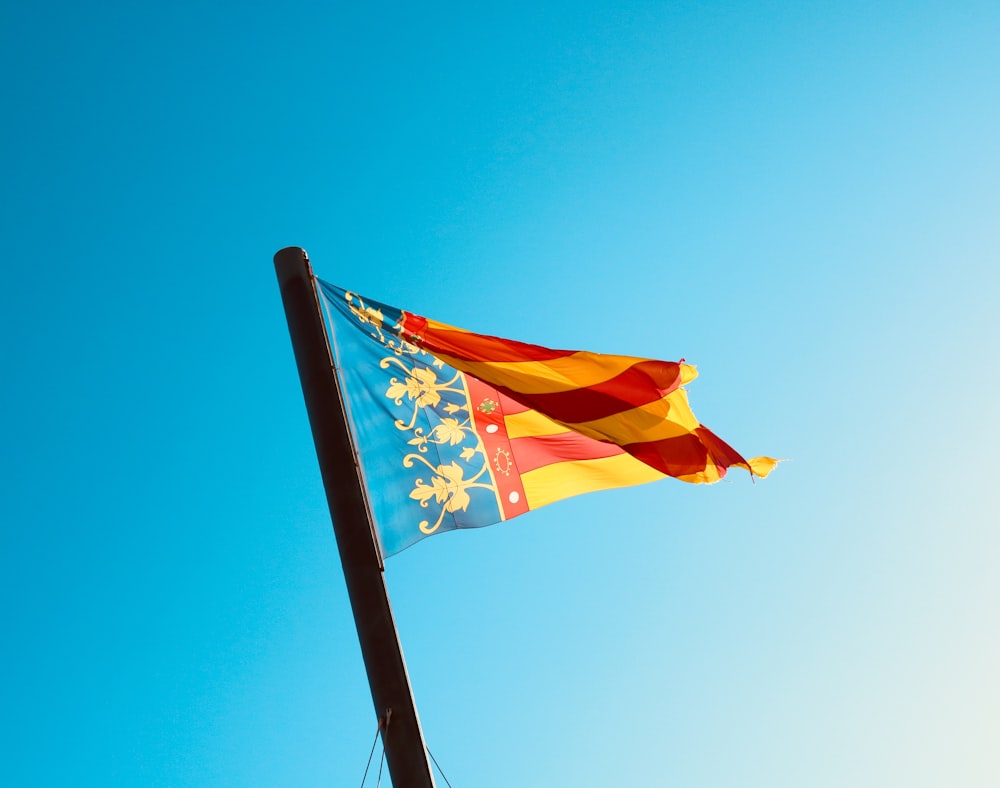 red, yellow, and blue flag during daytime
