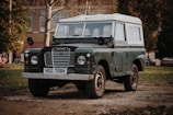 green and white Land Rover SUV on road