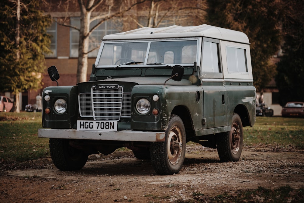 green and white Land Rover SUV on road