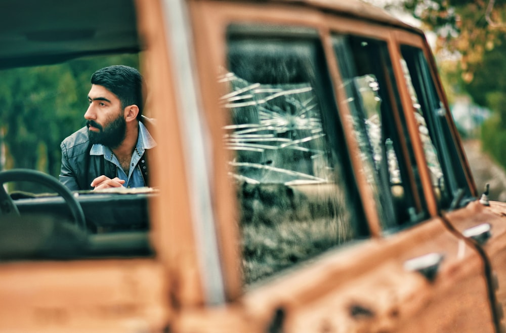 man standing in front of vehicle