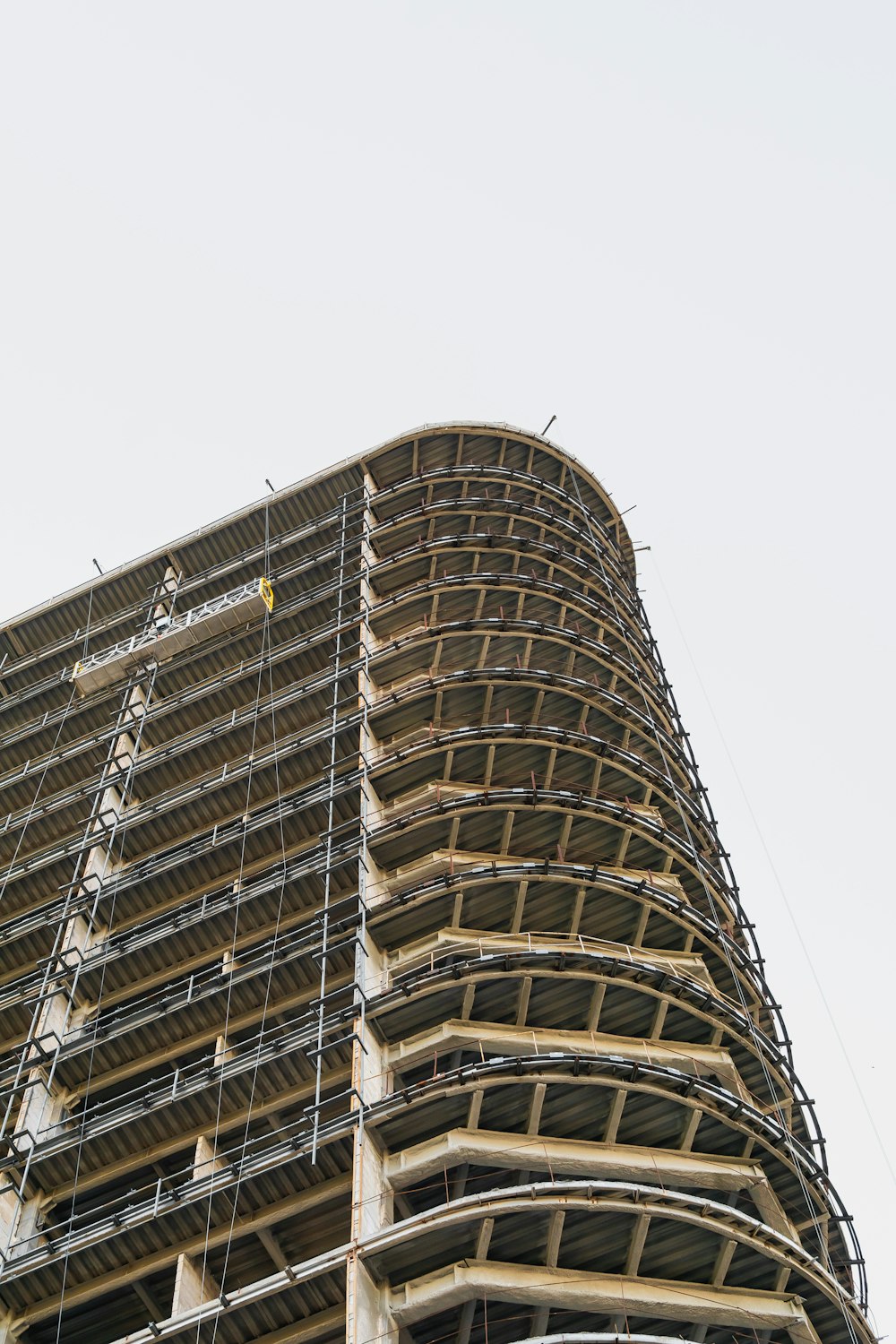 low-angle photography of white concrete building during daytime