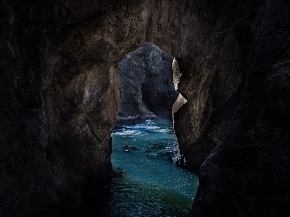 cave with body of water inside