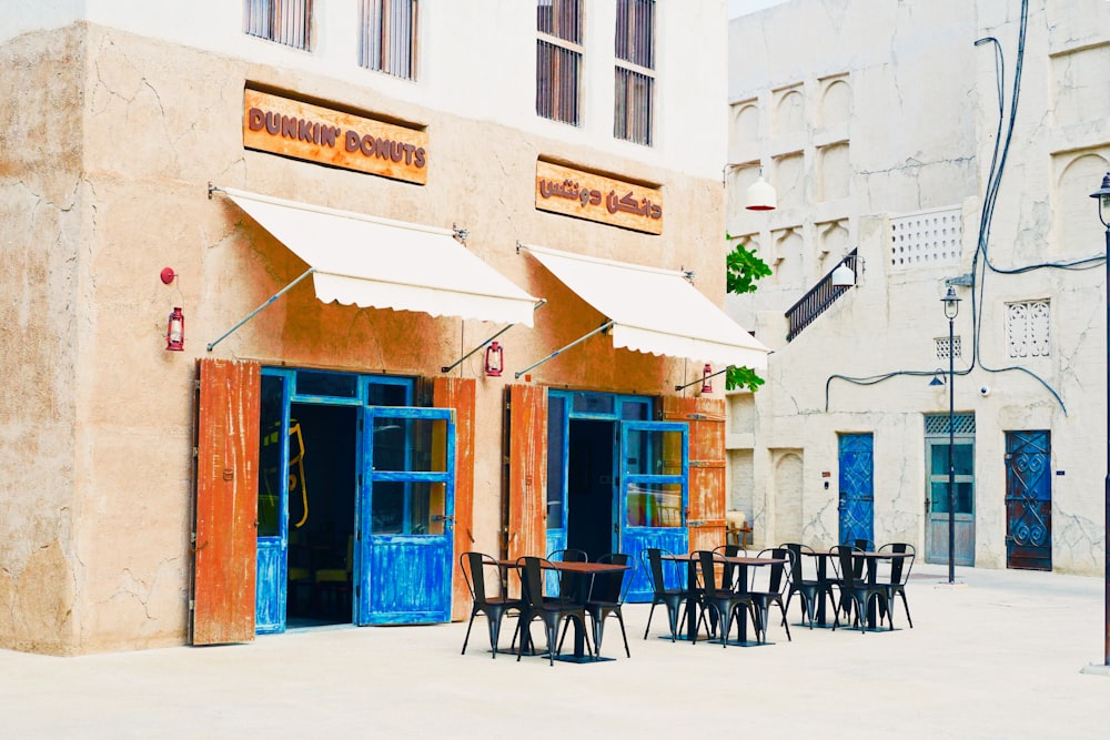 tables and chairs placed outside building