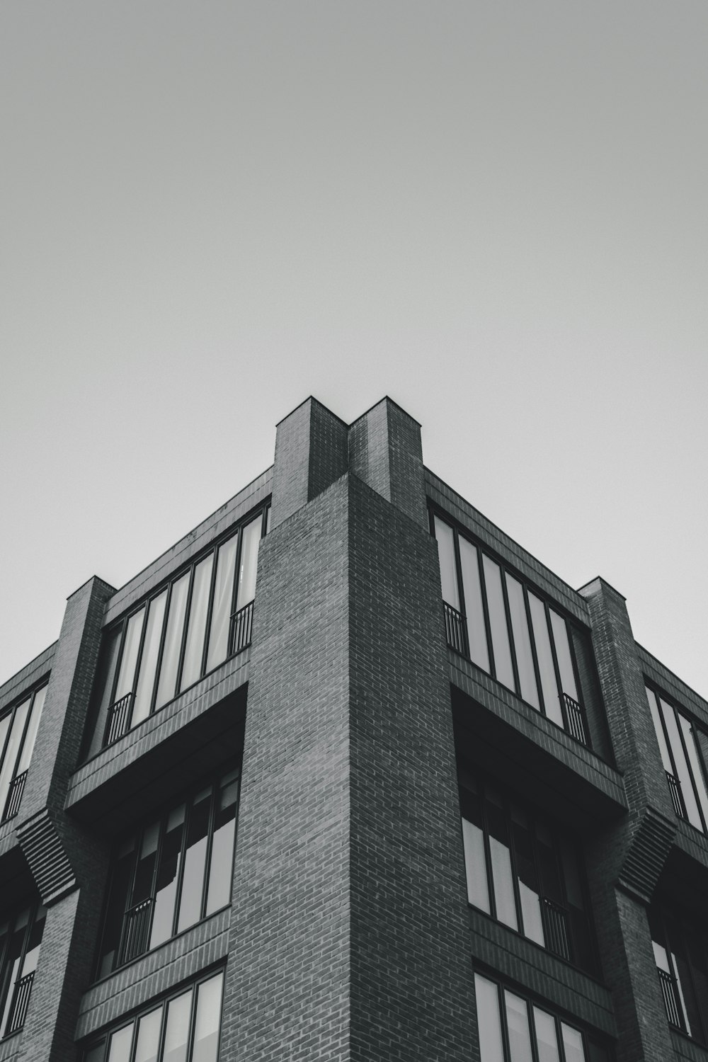 grayscale photography of high rise building