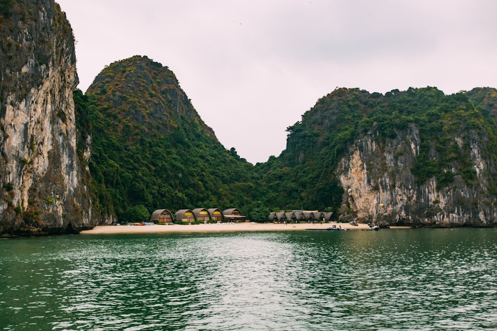 cottages in beach in cove surrounded by hills