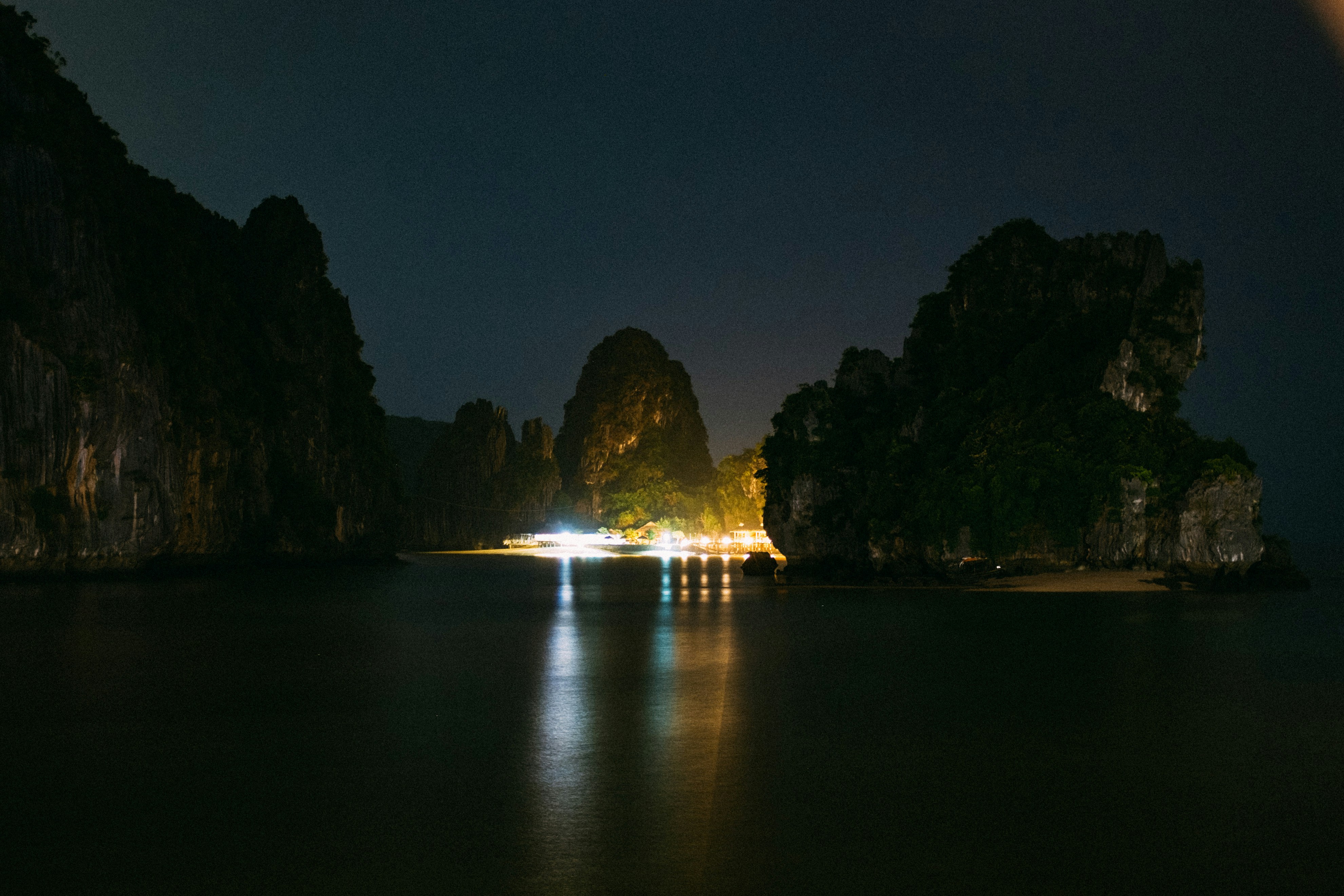 rock formation under gray sky at nighttime, 