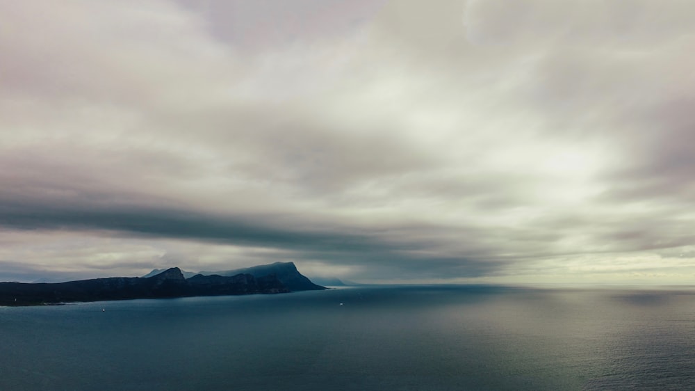 cloudy sky over hill in beach