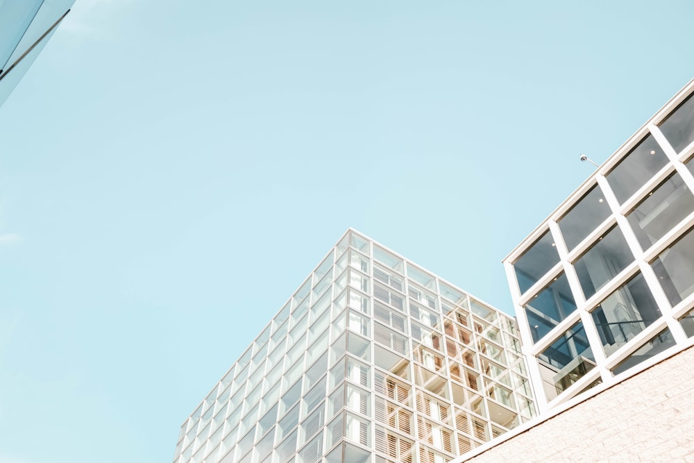 low angle photography of glass curtain building during daytime