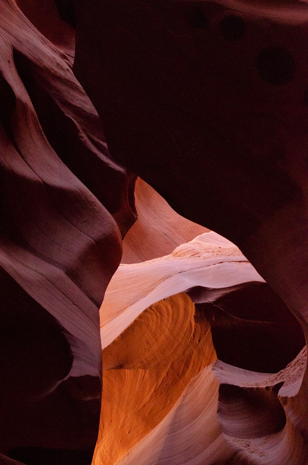 a narrow slot in the side of a canyon