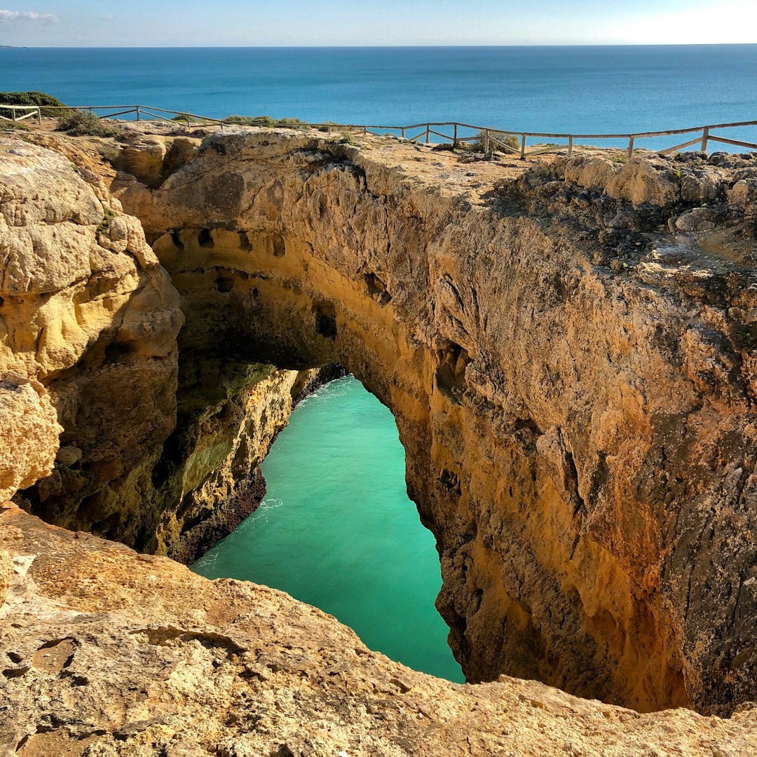 Natural arch photo spot Faro Marinha beach