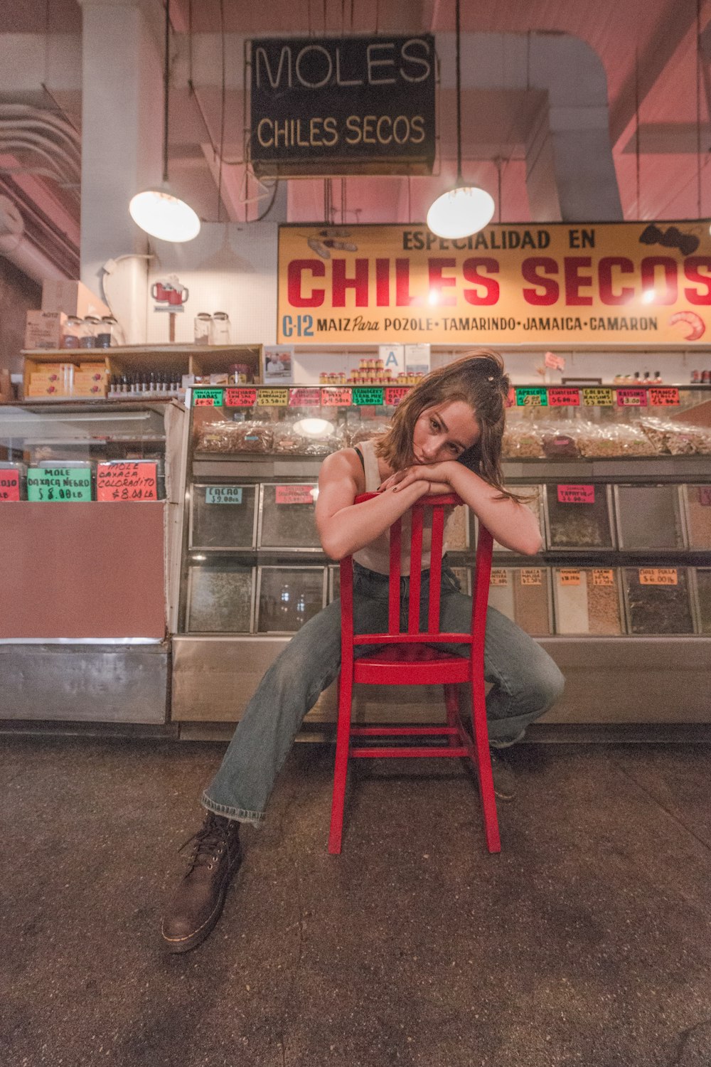 woman sitting on red chair