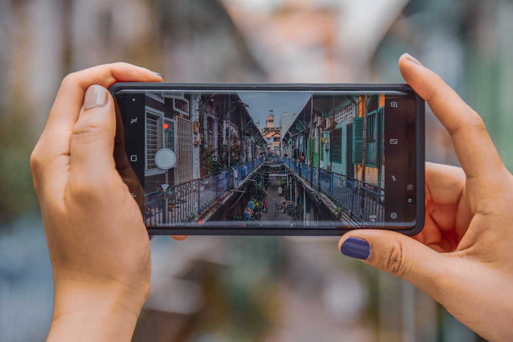 black Android smartphone camera capturing buildings