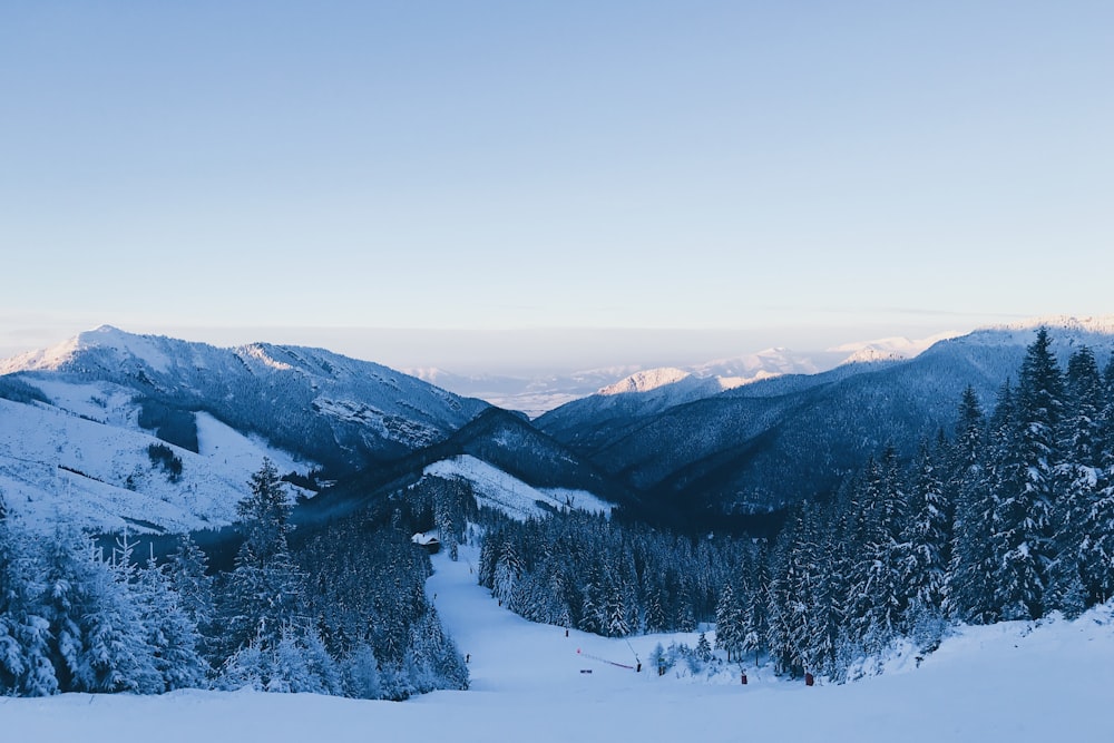 snow capped mountains under white sky