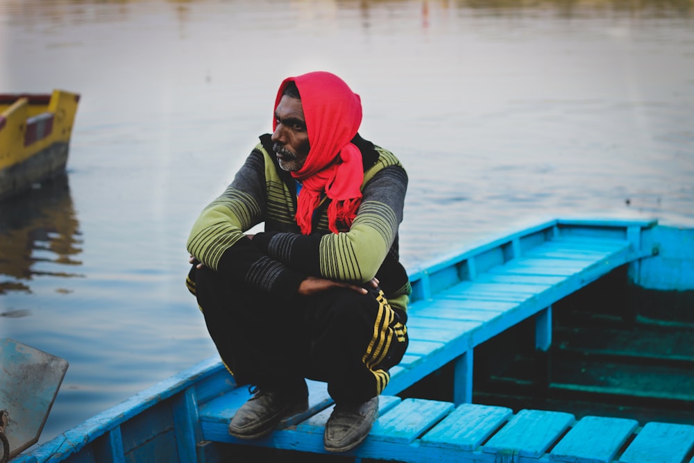 man sitting on boat