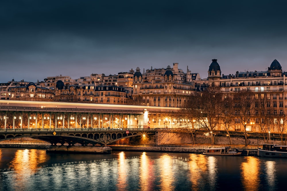 lighted buildings near the river