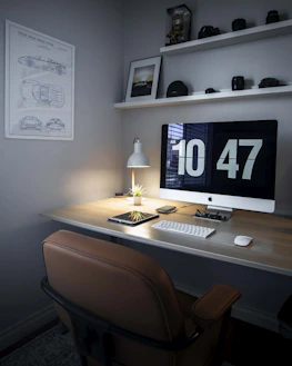 A clean desk setup displaying workflow charts and schedules for a home service business.