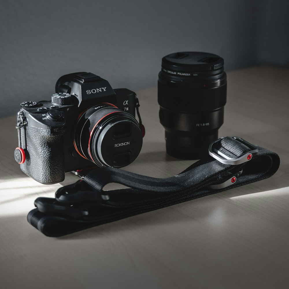 black Sony DSLR camera with lens