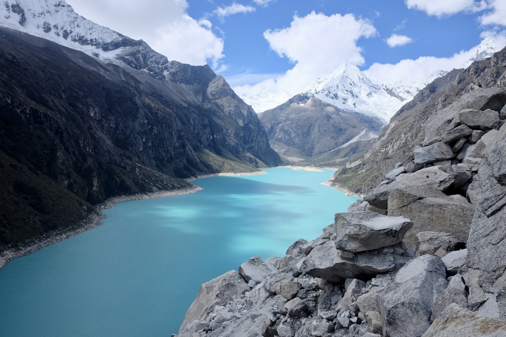 blue lake between rock formations