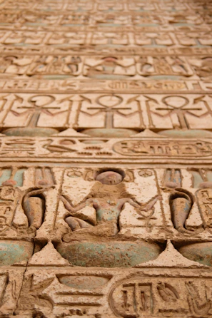 A striking fusion of Viking runes and Egyptian hieroglyphs carved into ancient stone.
