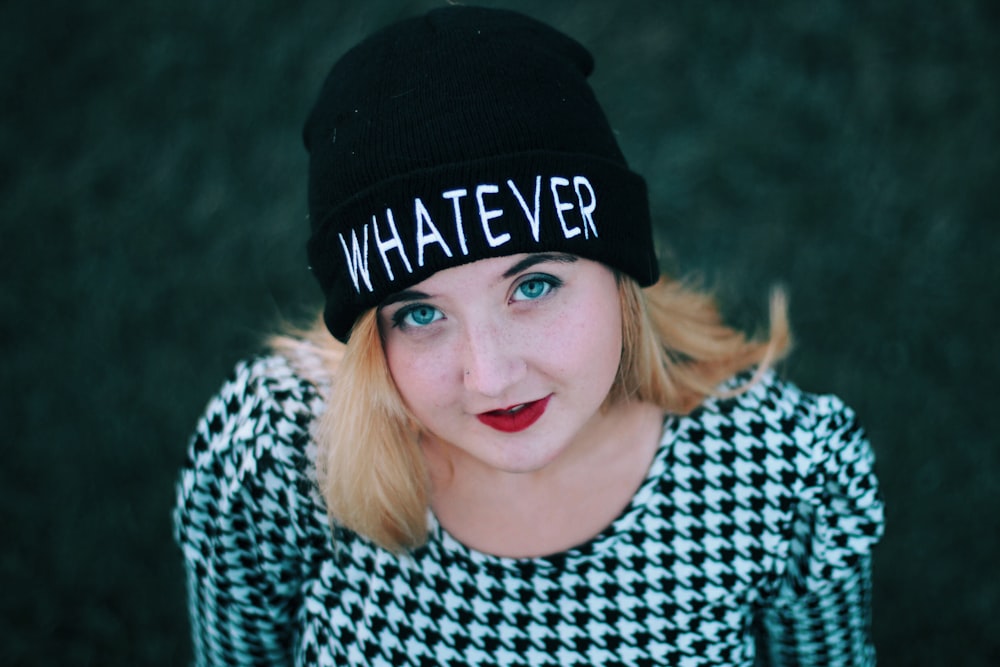 smiling woman wearing black knit cap