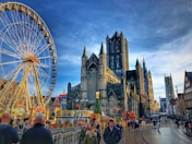people walking near ferries wheel