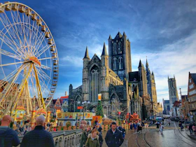 people walking near ferries wheel