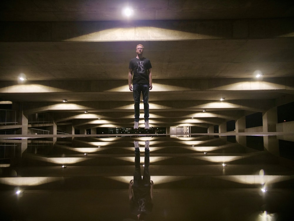 man standing under building