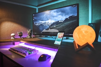 turned-on black flat screen monitor