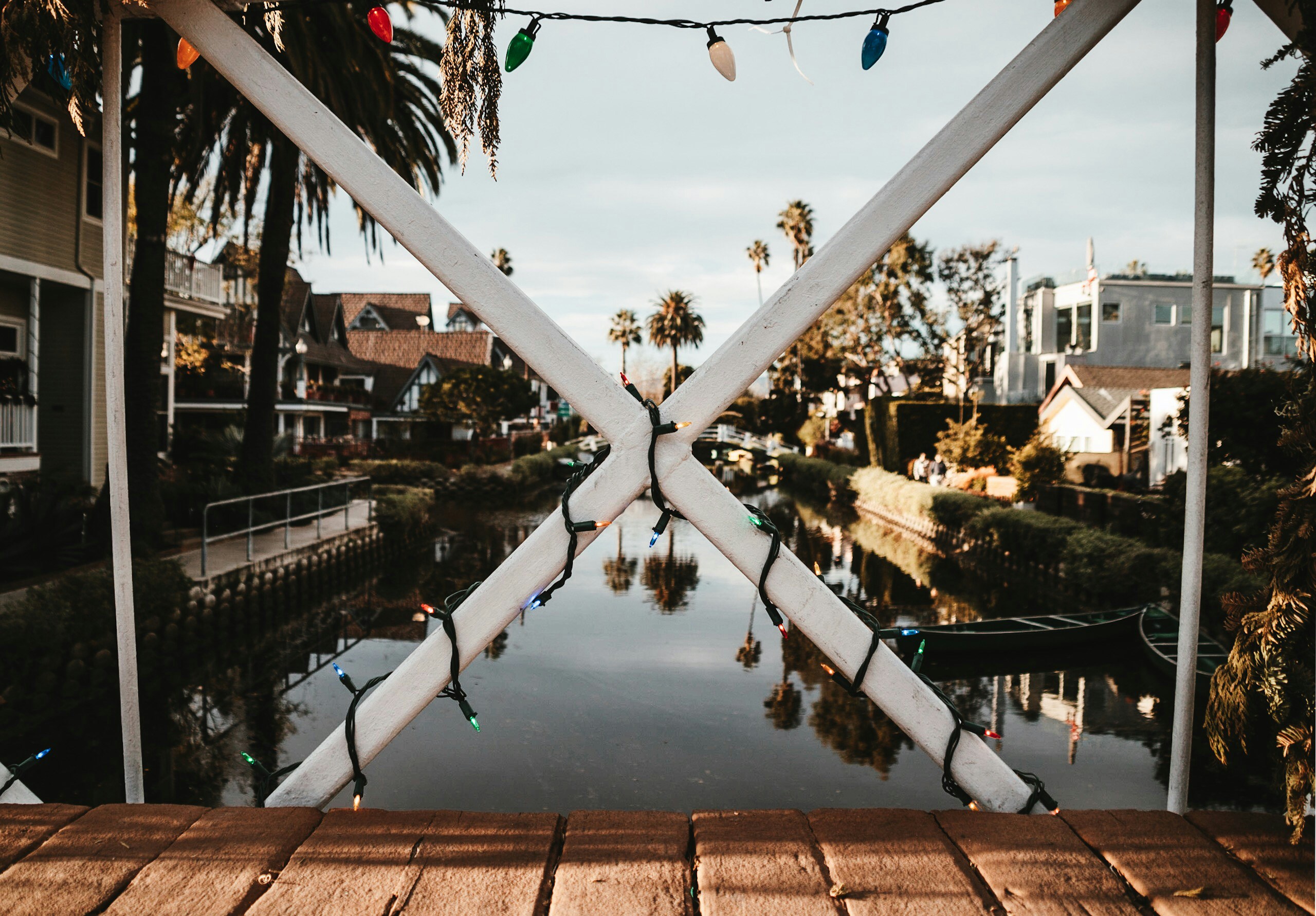 wooden bridge over body of water, 