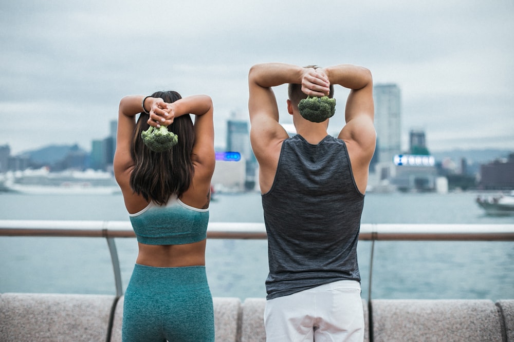 woman standing beside man during daytime