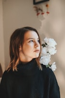 A softly lit portrait of hollyrose working thoughtfully on her latest design.