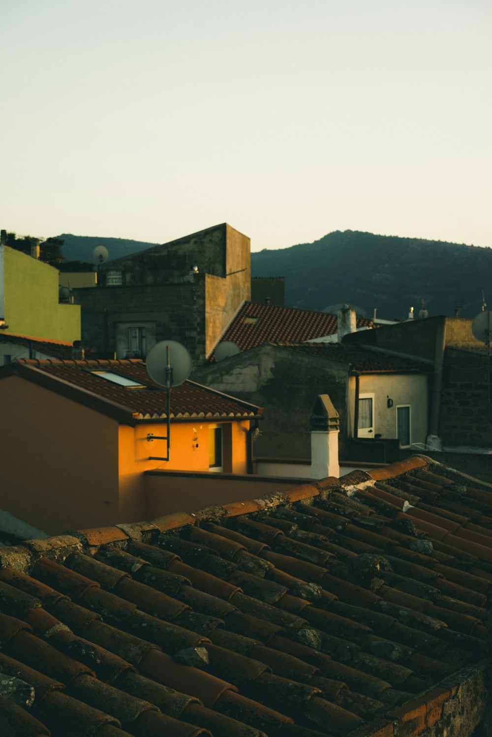 brown concrete buildings under grey sky