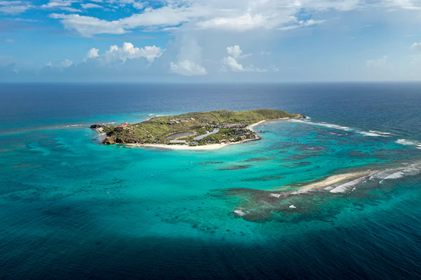 Aerial view of a reef-ringed island in the British Virgin Islands surrounded by turquoise water
