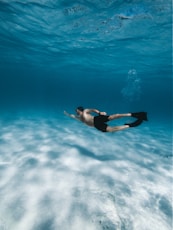 man swimming in water