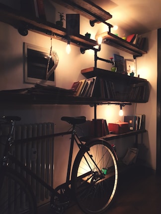 A cozy basement transformation featuring warm lighting and stylish built-in shelves.